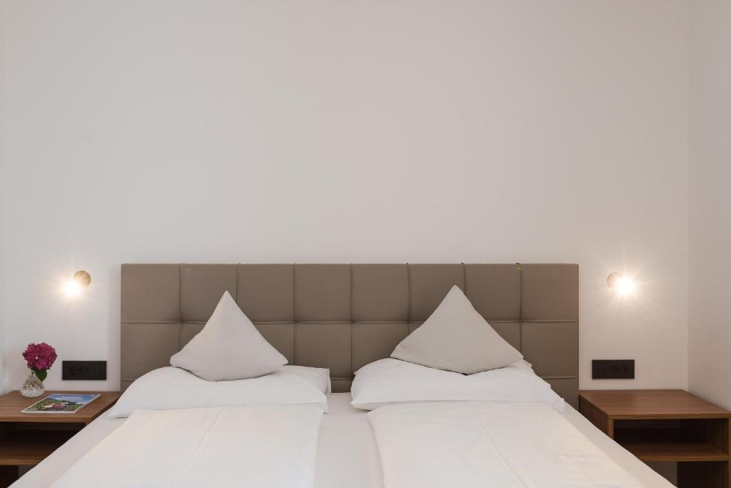 Postel nebo postele na pokoji v ubytování Hotel Mandelhof