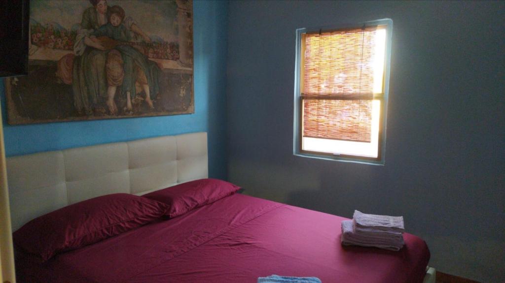 Łóżko lub łóżka w pokoju w obiekcie Casa Carlo