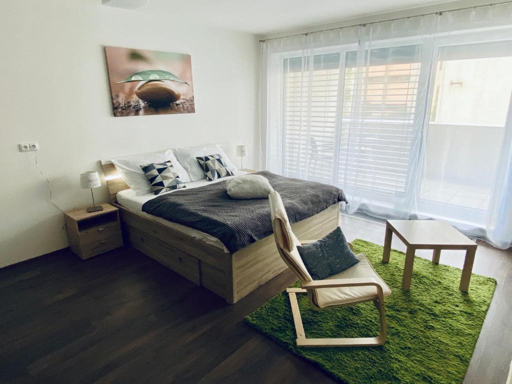 Postel nebo postele na pokoji v ubytování Apartmány Duo Třeboň