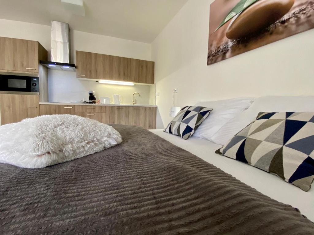 Postel nebo postele na pokoji v ubytování Apartmány Duo Třeboň