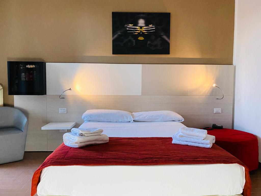 Postel nebo postele na pokoji v ubytování Hotel Ristorante Novara Expo