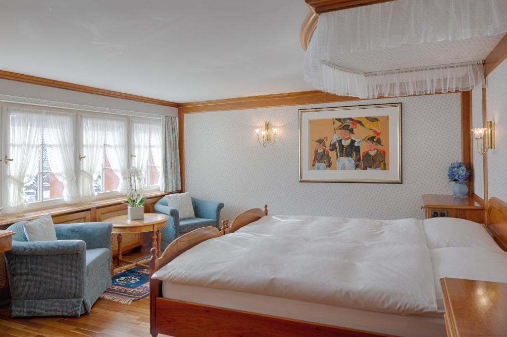 Postel nebo postele na pokoji v ubytování Romantik Hotel Säntis