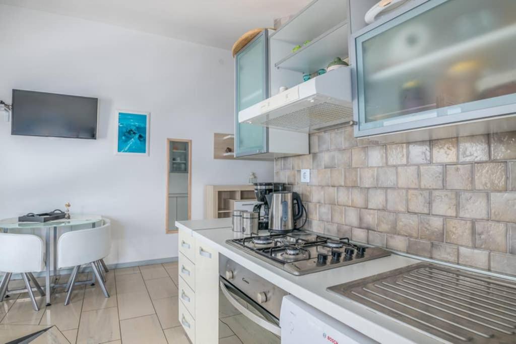 Kuchyň nebo kuchyňský kout v ubytování Apartment Windrose