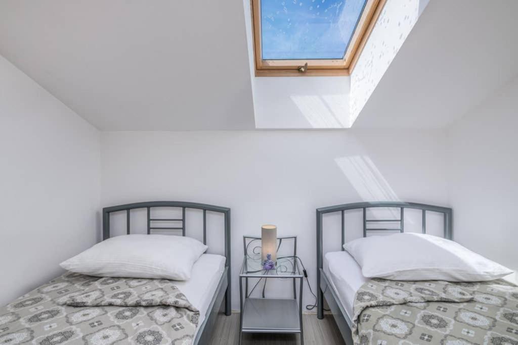 Postel nebo postele na pokoji v ubytování Apartment Windrose