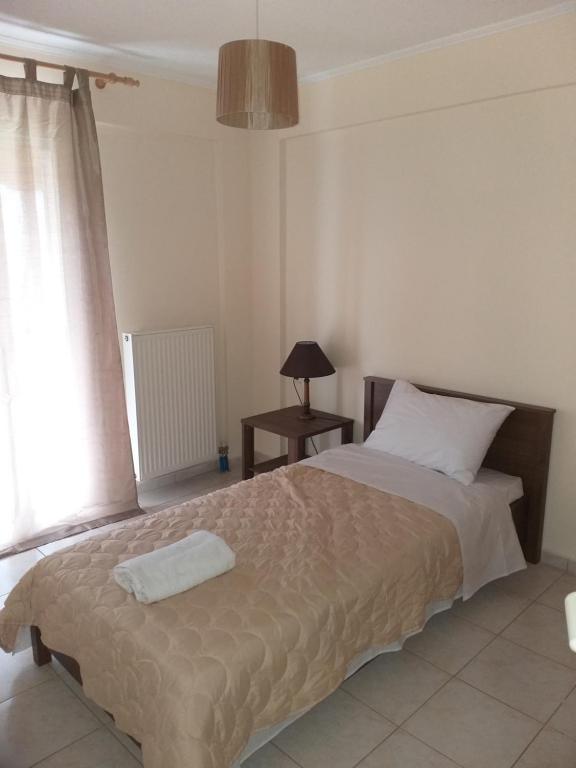 Posteľ alebo postele v izbe v ubytovaní Ostria Seaside Apartments