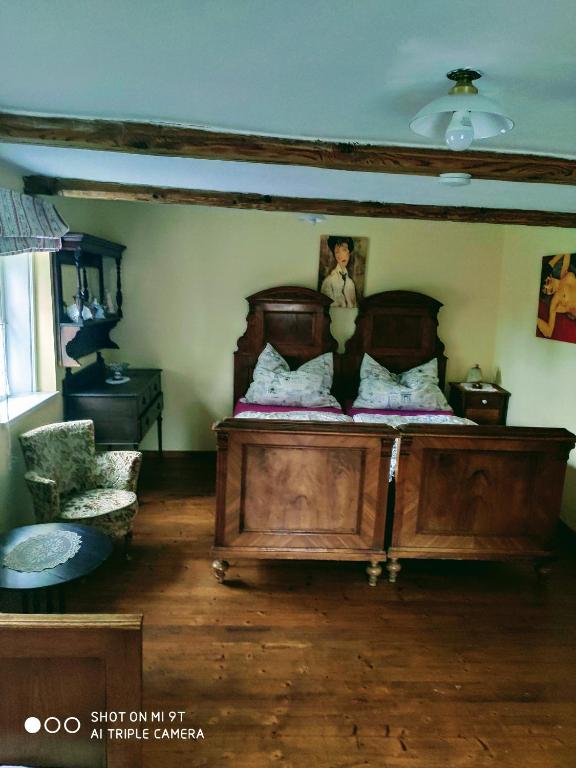Postel nebo postele na pokoji v ubytování Penzion Nostalgie 1876
