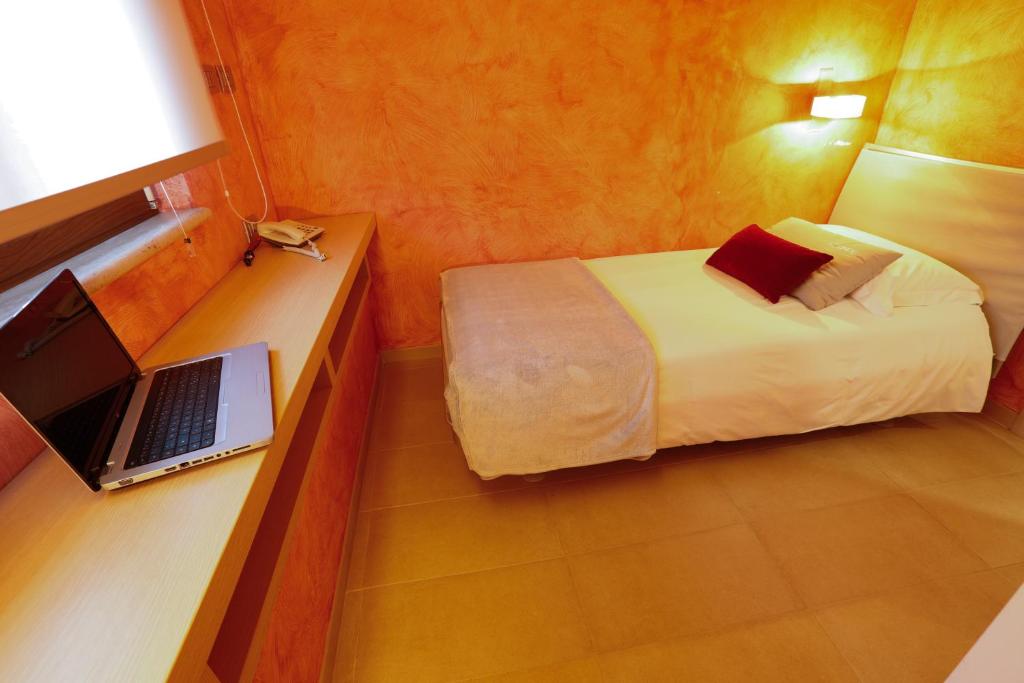 Postel nebo postele na pokoji v ubytování Le Onde Resort