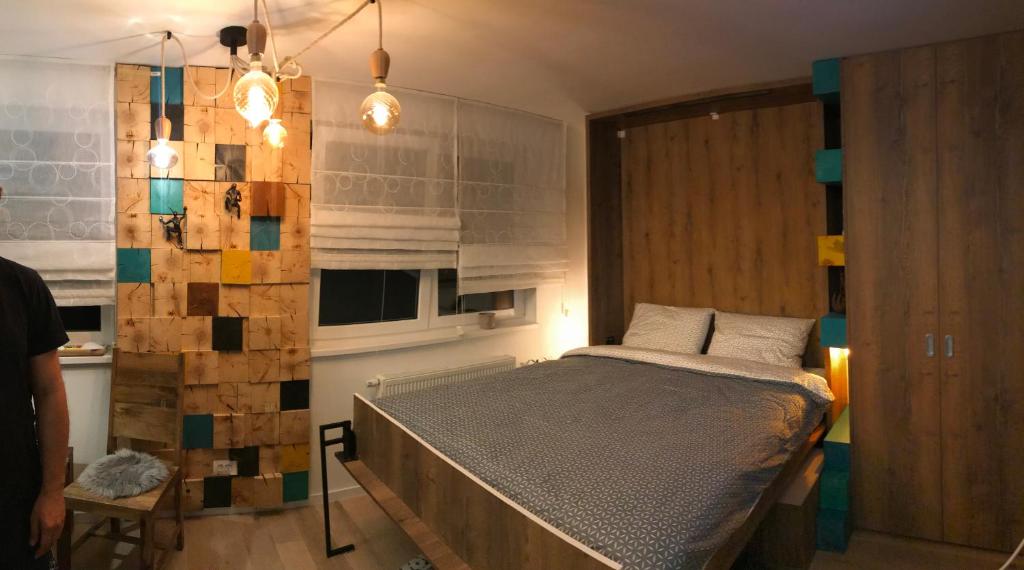 a bedroom with a large bed in a room at Olimpijska kuca Jahorina - Apartman A708 in Jahorina