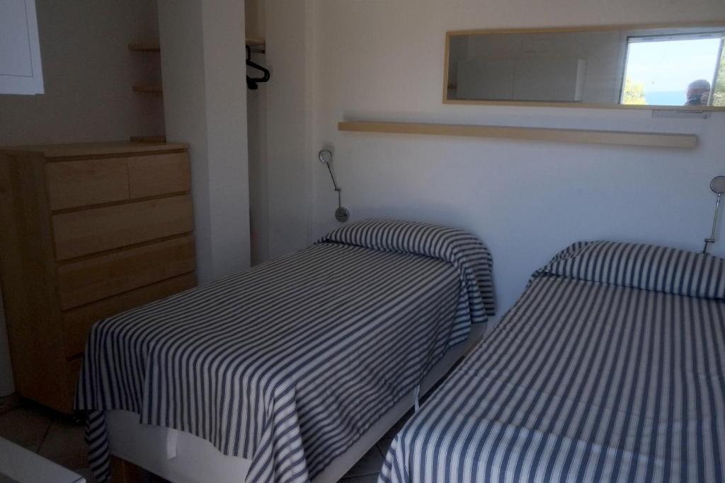Postel nebo postele na pokoji v ubytování Carloforte Bellavista