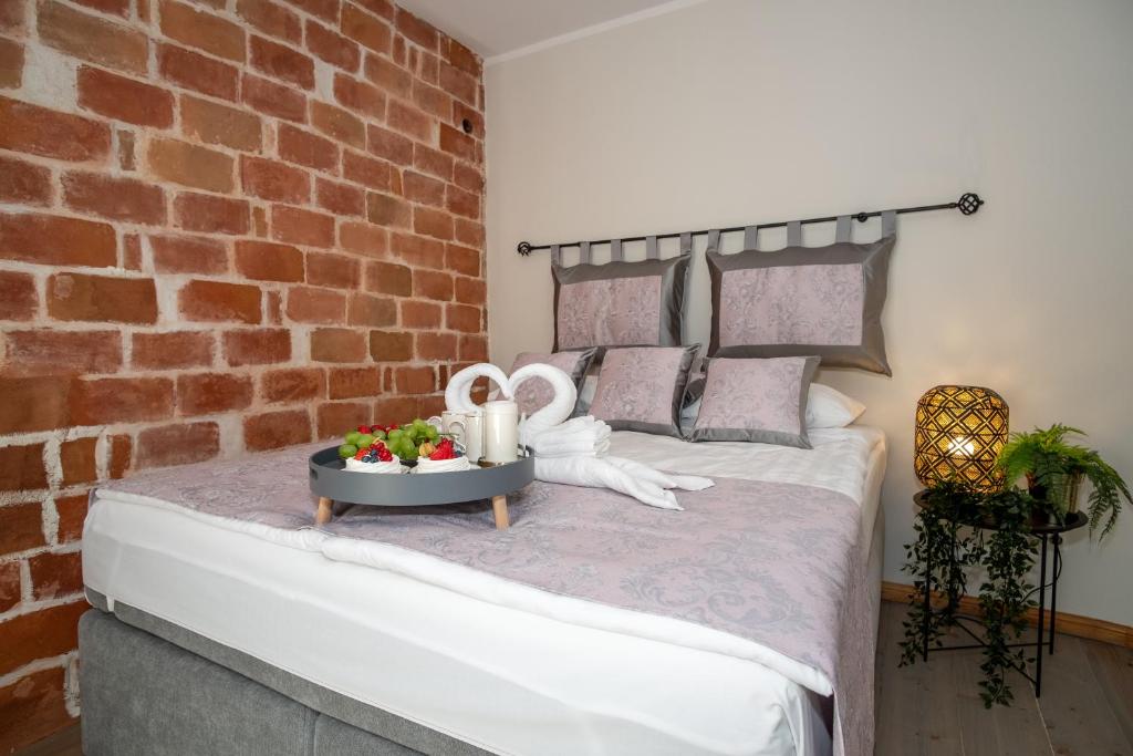 Postel nebo postele na pokoji v ubytování Rataskaevu Boutique - 7 Unique Apartments