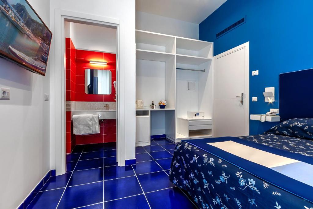 Postel nebo postele na pokoji v ubytování Hotel Metropole
