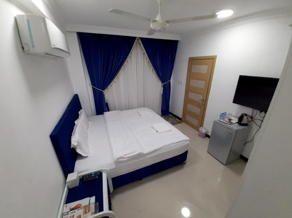 Postel nebo postele na pokoji v ubytování Al Rayyan Hotel Apartments Muscat