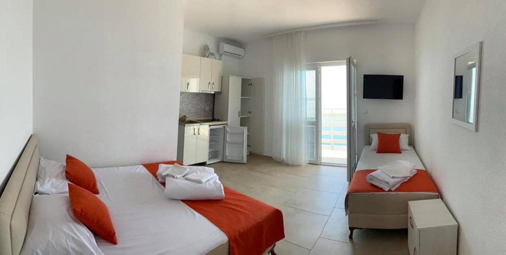 Postel nebo postele na pokoji v ubytování Jelić apartmani