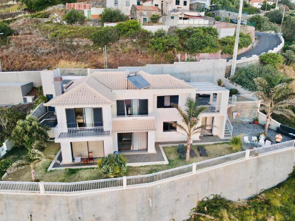 an aerial view of a house at The best sea view in Madeira - Casa Farol in Fajã da Ovelha