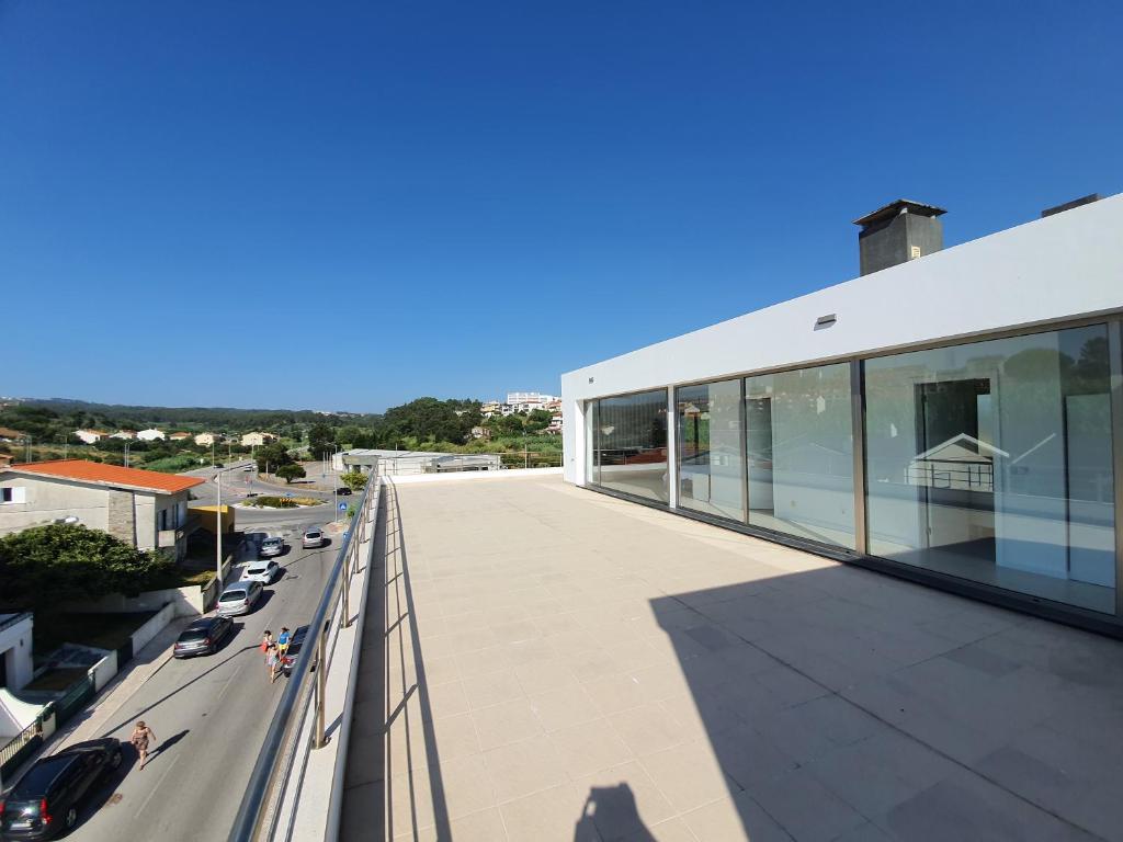 a view from the balcony of a building at Figueira Beach Apartment in Buarcos