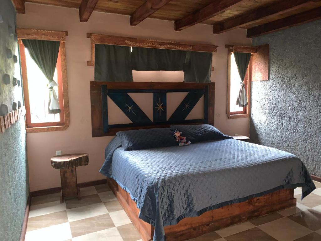 Postel nebo postele na pokoji v ubytování Cabaña Amanecer
