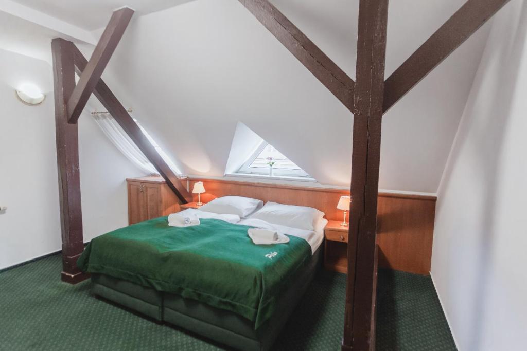Postel nebo postele na pokoji v ubytování Hotel Peko