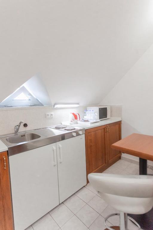 Kuchyň nebo kuchyňský kout v ubytování Hotel Peko