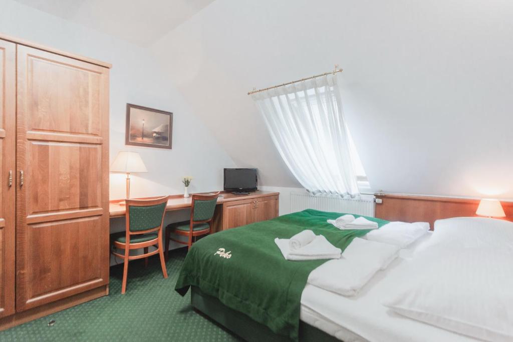 Postel nebo postele na pokoji v ubytování Hotel Peko
