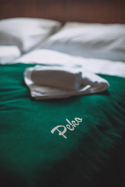 Postel nebo postele na pokoji v ubytování Hotel Peko