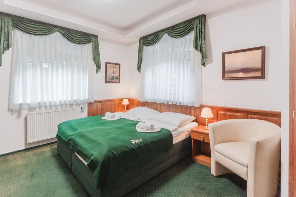 Postel nebo postele na pokoji v ubytování Hotel Peko