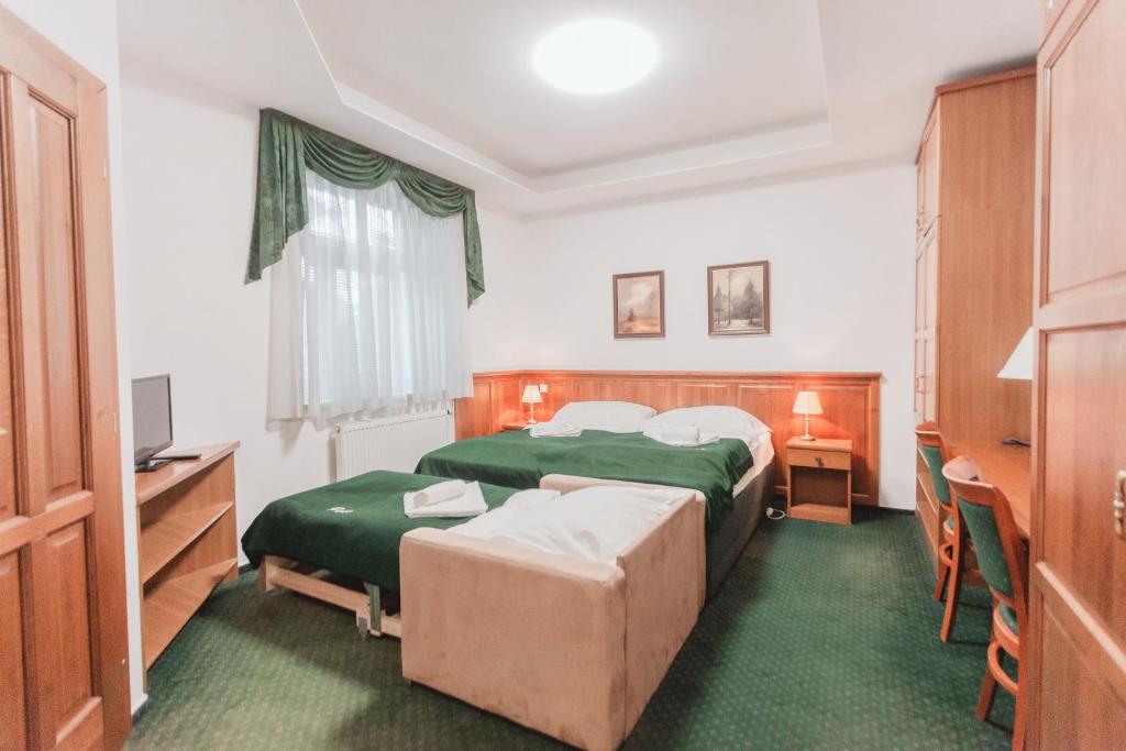 Postel nebo postele na pokoji v ubytování Hotel Peko