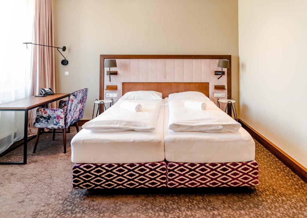Postel nebo postele na pokoji v ubytování Hotel Eitljörg