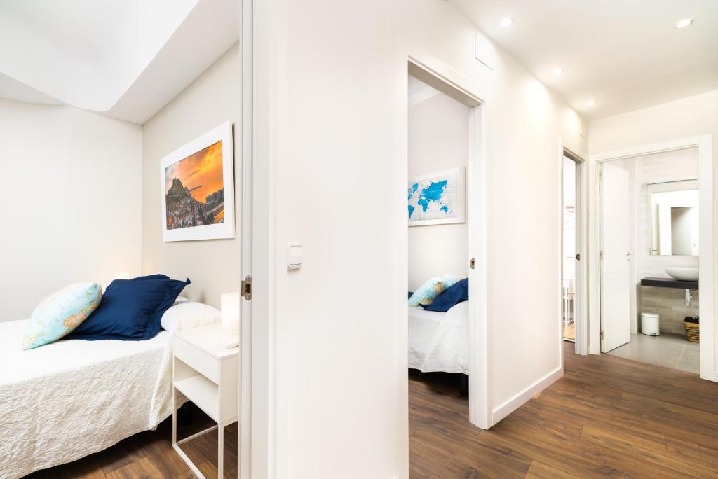 A bed or beds in a room at La Casa de los Mapas