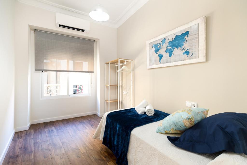 A bed or beds in a room at La Casa de los Mapas