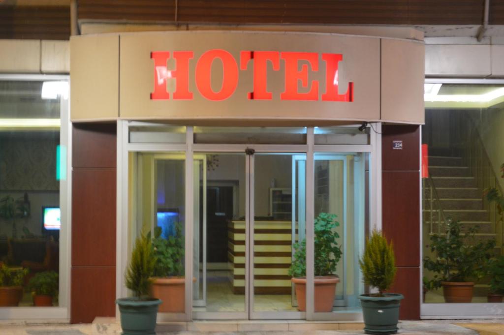 a hotel with a sign on the front of it at Isık Hotel in Edirne