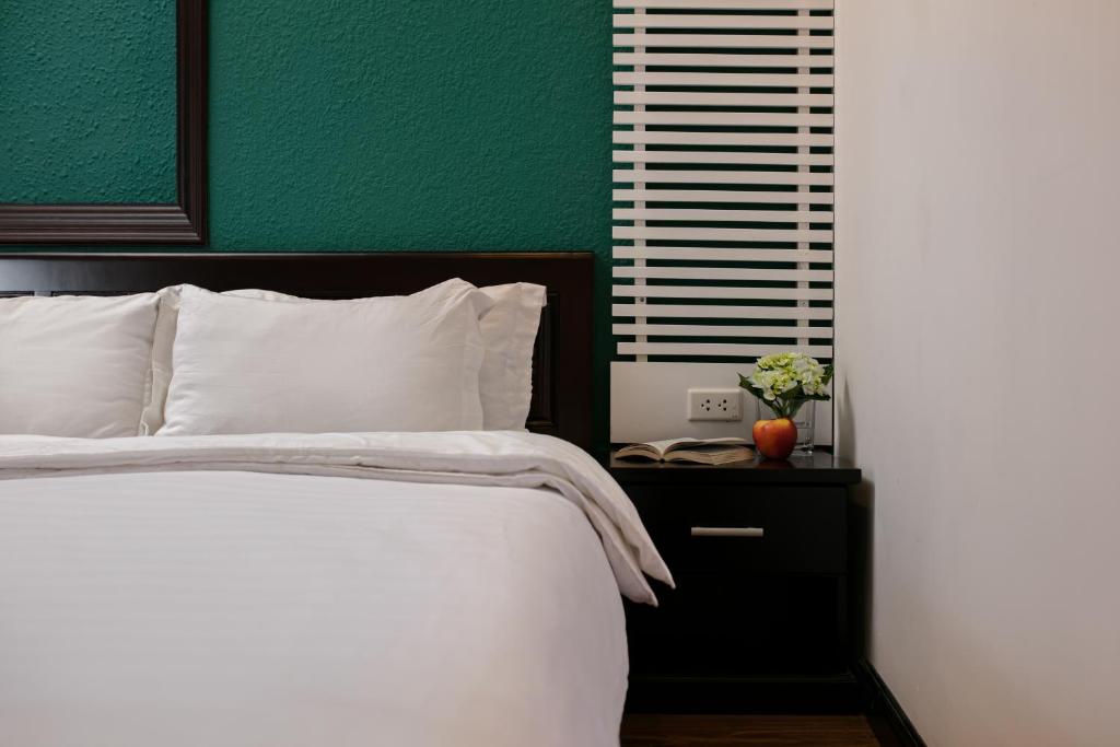 Postel nebo postele na pokoji v ubytování ĐỨC TRỌNG HOTEL