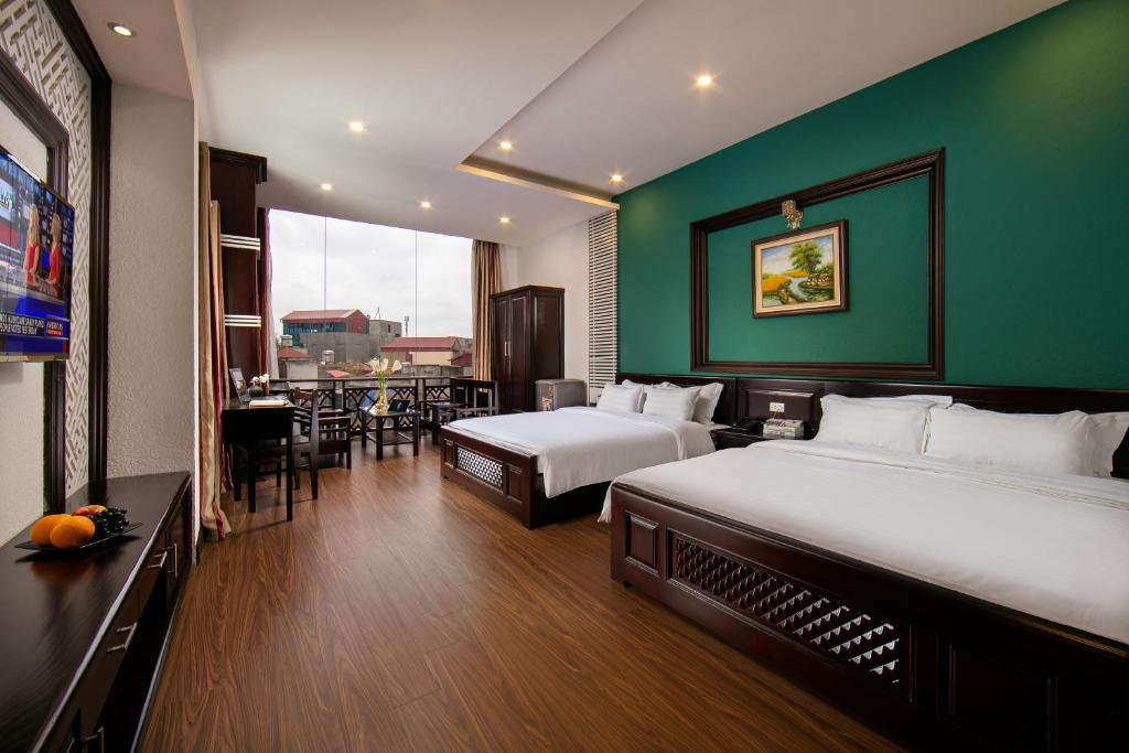 Postel nebo postele na pokoji v ubytování ĐỨC TRỌNG HOTEL