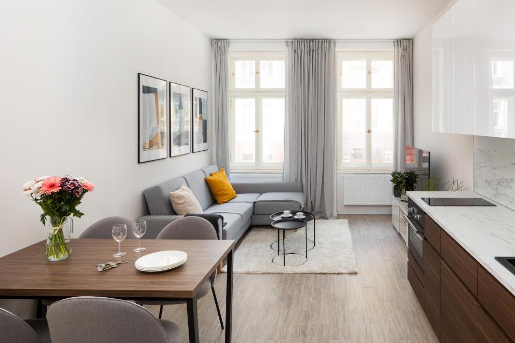 a living room with a couch and a table at Stylish Flat in Nusle by Prague Days in Prague