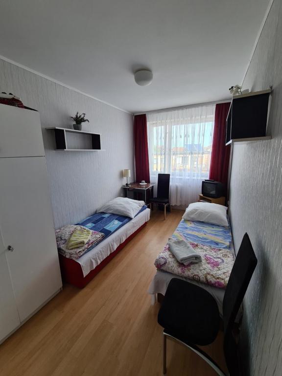 Postel nebo postele na pokoji v ubytování Ośrodek wczasowy Ewa