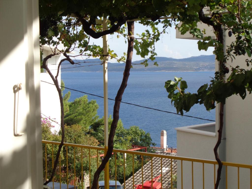 a view of the ocean from a house at APARTMAN ZORAN MARUSIC in Marusici 