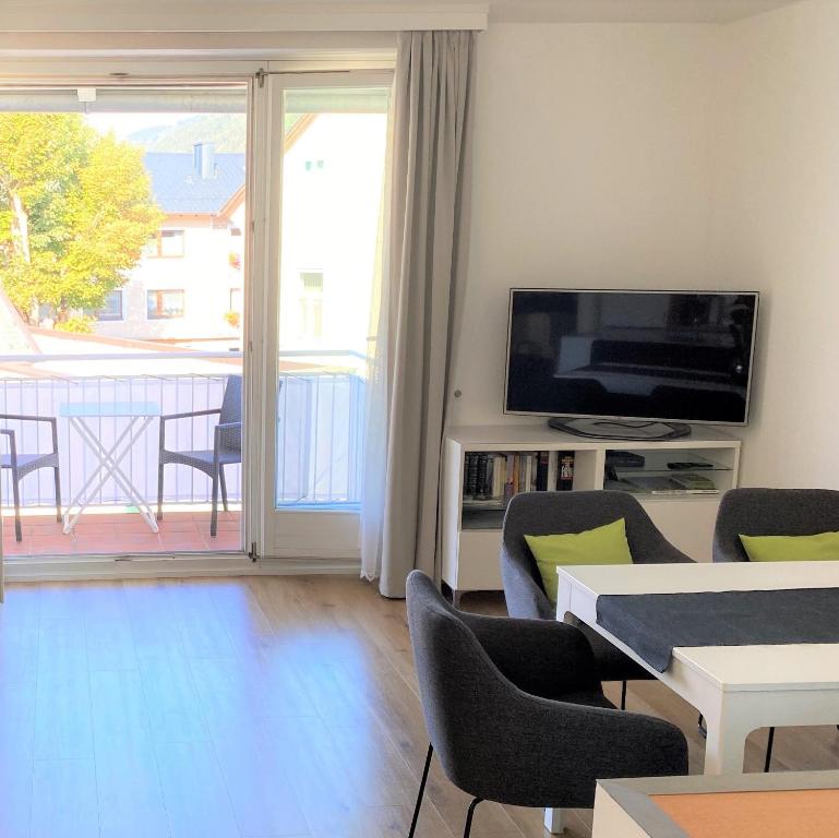 Televízia a/alebo spoločenská miestnosť v ubytovaní Haus Silent - Mountain View