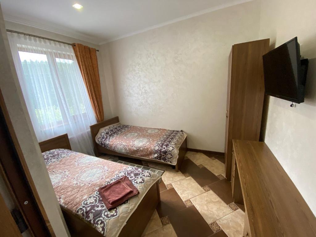 Postel nebo postele na pokoji v ubytování Оранта