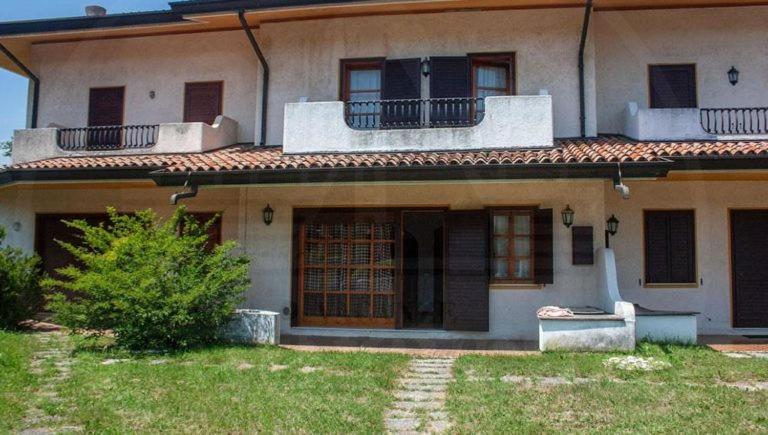 a large house with two balconies on top of it at VILLA ROSA in Duna Verde