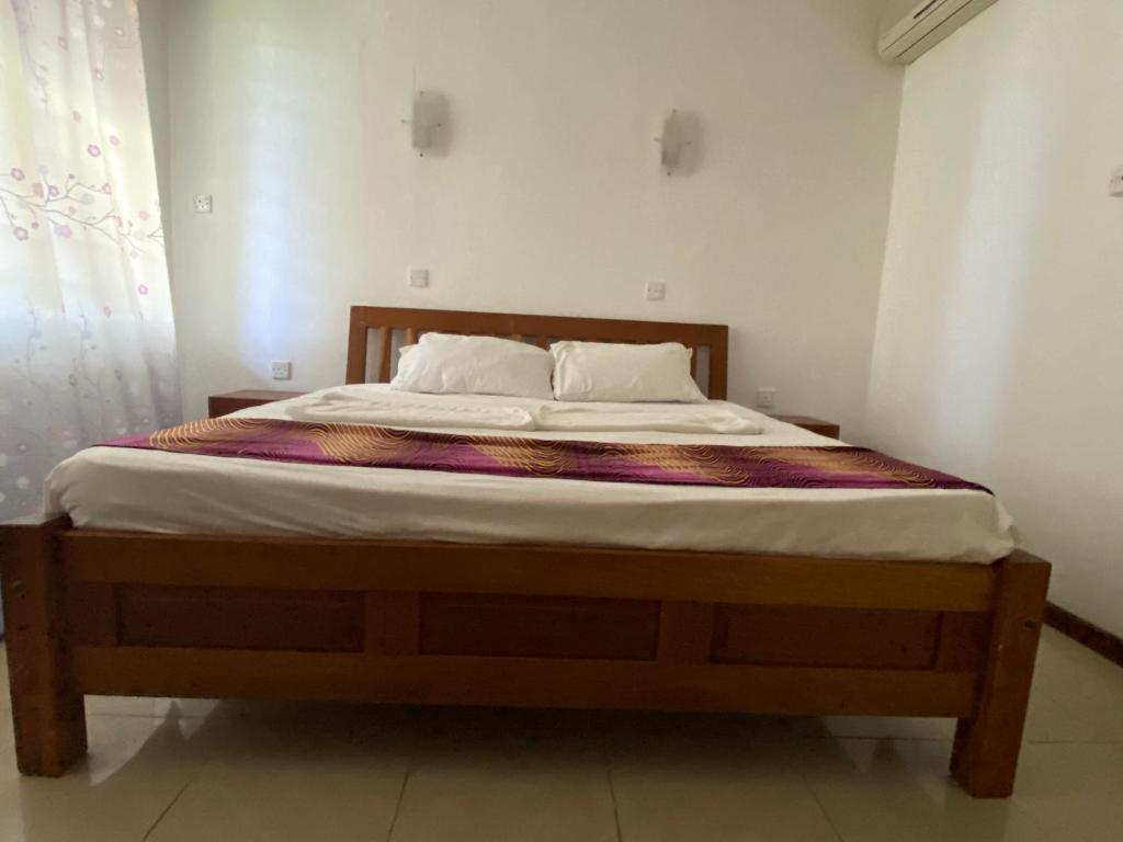 Postel nebo postele na pokoji v ubytování Paradise Resort Apartments