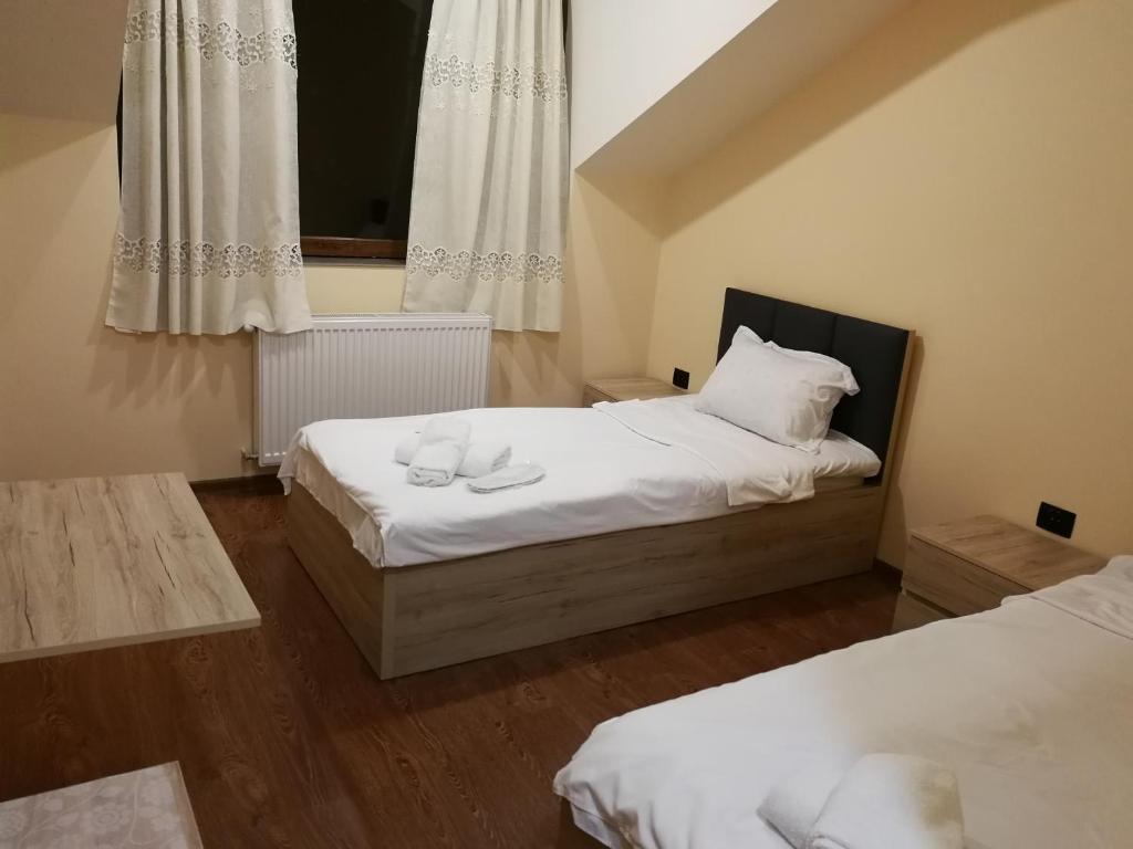 Postel nebo postele na pokoji v ubytování Favourite
