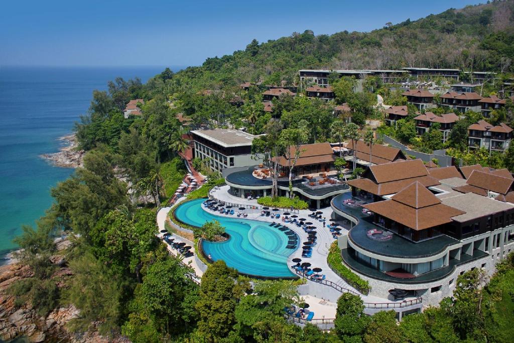 an aerial view of a resort with a pool at Pullman Phuket Arcadia Naithon Beach in Nai Thon Beach