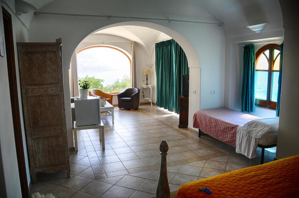 Postel nebo postele na pokoji v ubytování Hotel Dimora Fornillo