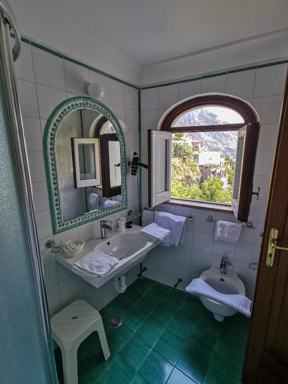 Postel nebo postele na pokoji v ubytování Hotel Dimora Fornillo