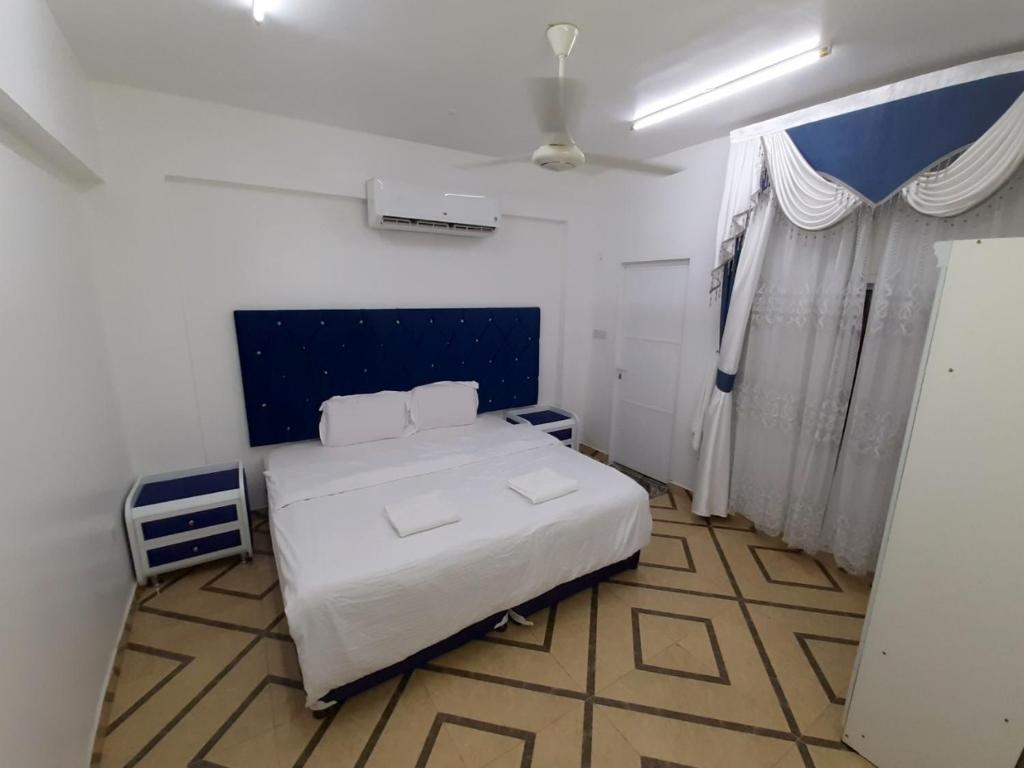 Postel nebo postele na pokoji v ubytování Al Rayyan Hotel Apartments Muscat