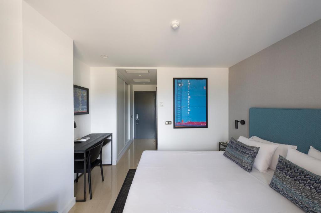 Posteľ alebo postele v izbe v ubytovaní Hotel Tahiti