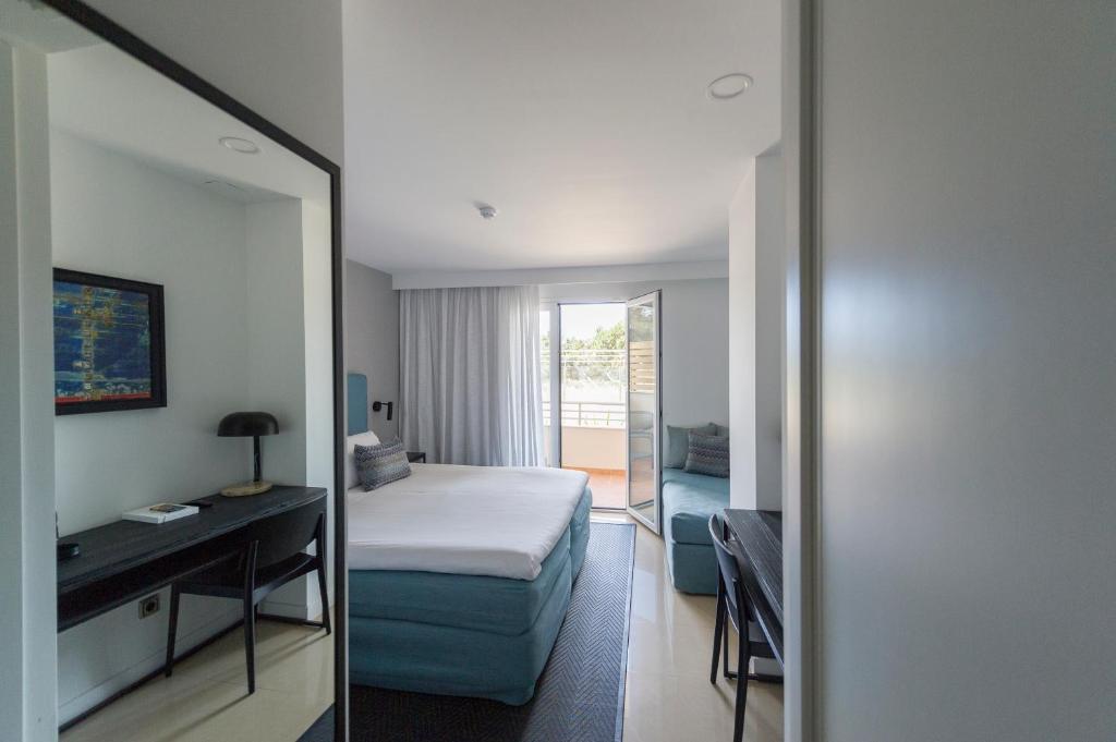 Posteľ alebo postele v izbe v ubytovaní Hotel Tahiti