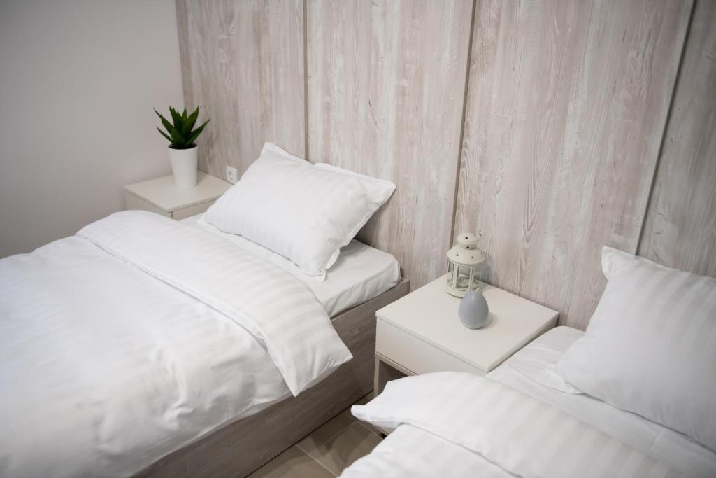 Postel nebo postele na pokoji v ubytování Apartmani Jović