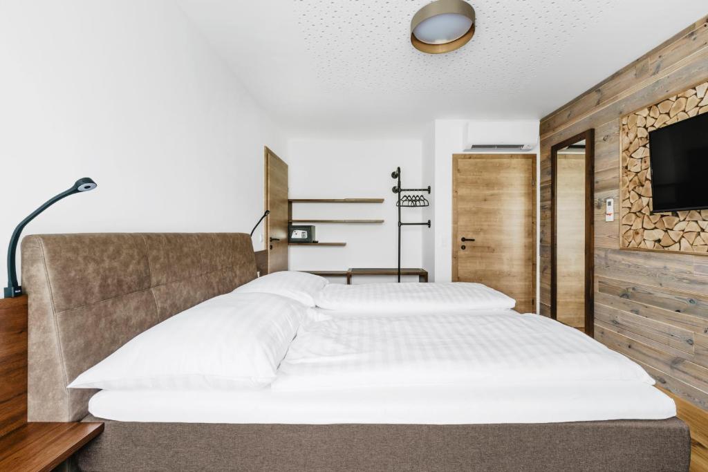 A bed or beds in a room at Jacky's Mühle