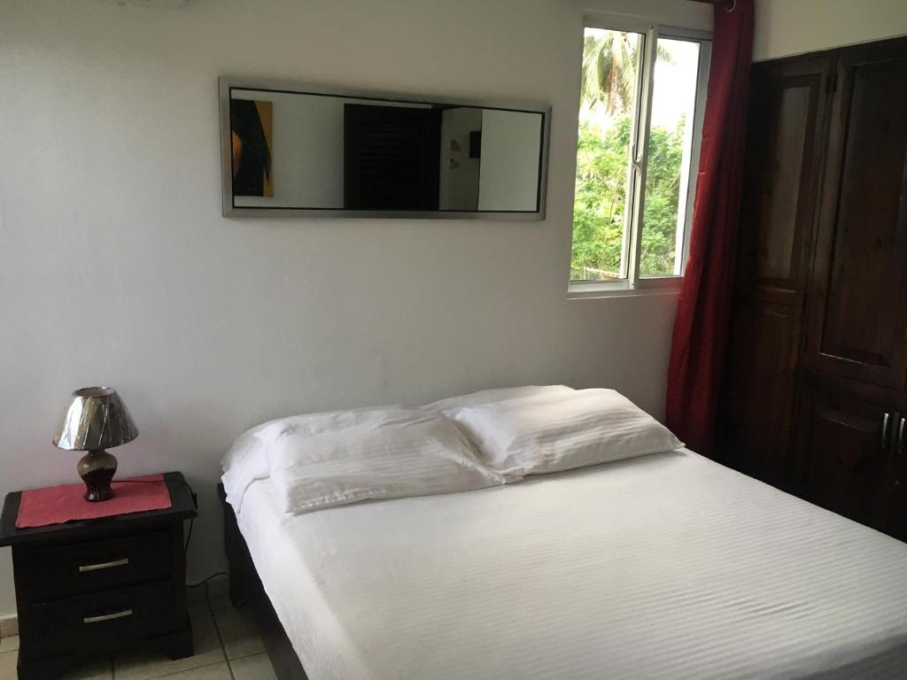 Postel nebo postele na pokoji v ubytování Cita del Sol City Apartments