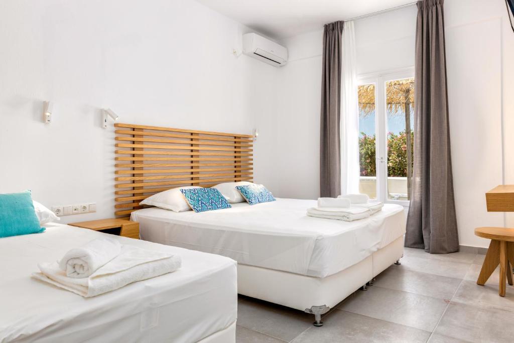 Posteľ alebo postele v izbe v ubytovaní Golden Beach Hotel